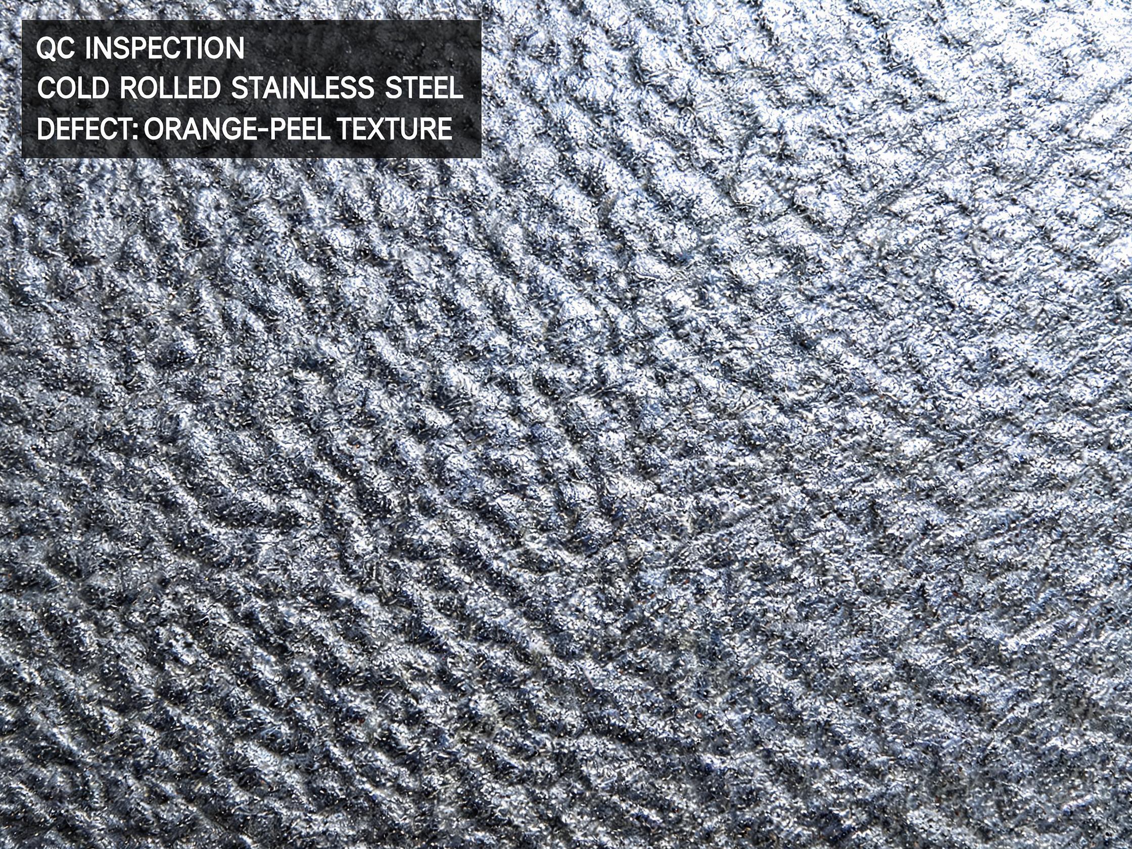 Close-up showing grainy orange peel texture on a stainless steel sheet surface